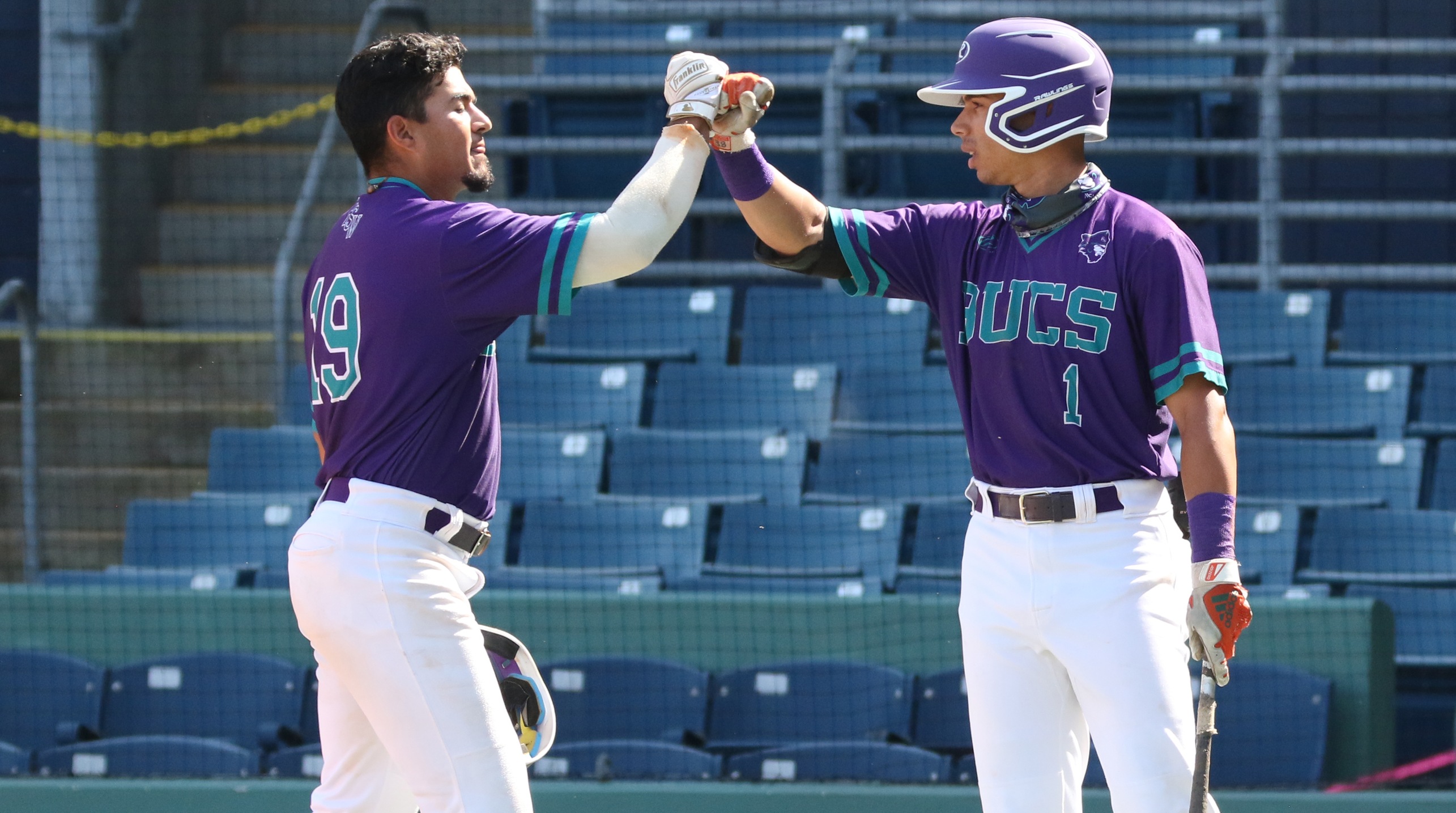 Christian Lucio celebrates his first inning home run with Luis Tuero (Photo by Roy Allen)
