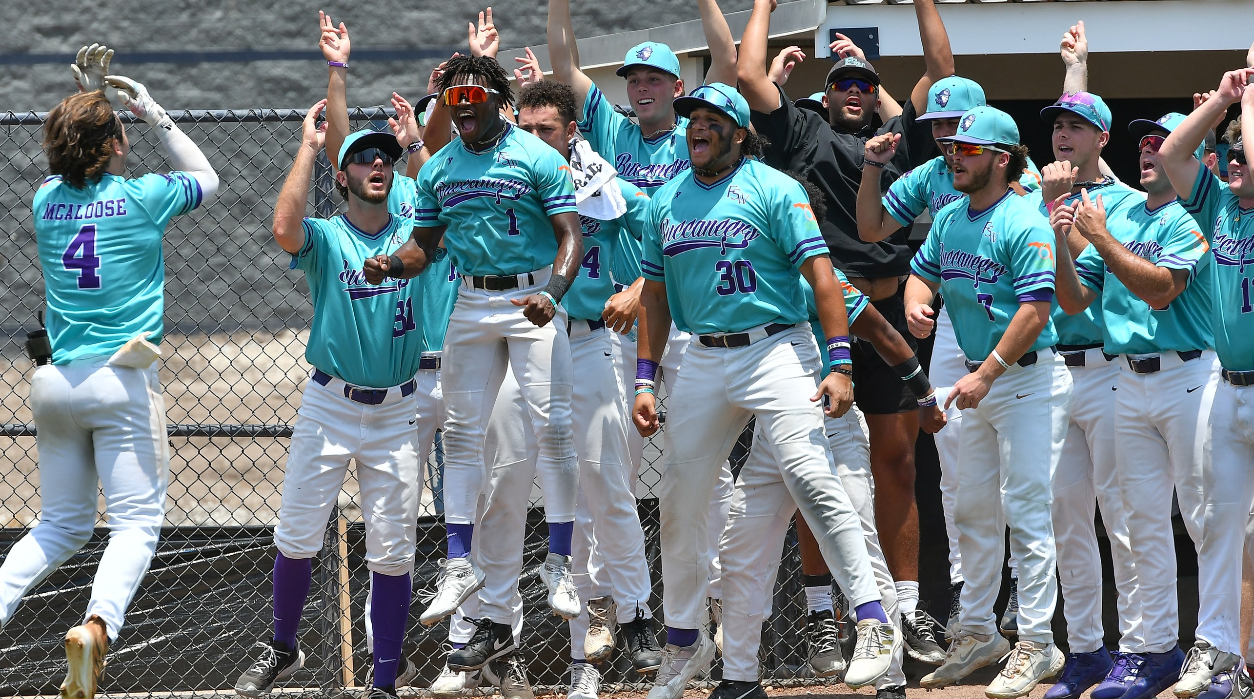 The Bucs celebrate Michael McAloose's 2nd inning home run (Photo by Tom Hagerty)